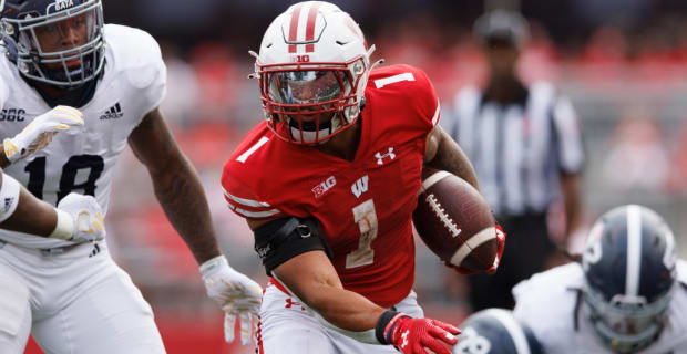 Wisconsin Badgers running back Chez Mellusi on a rushing attempt during a college football game in the Big Ten.